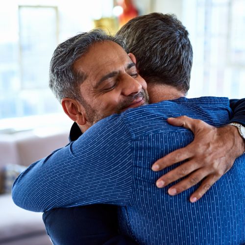 two men hugging